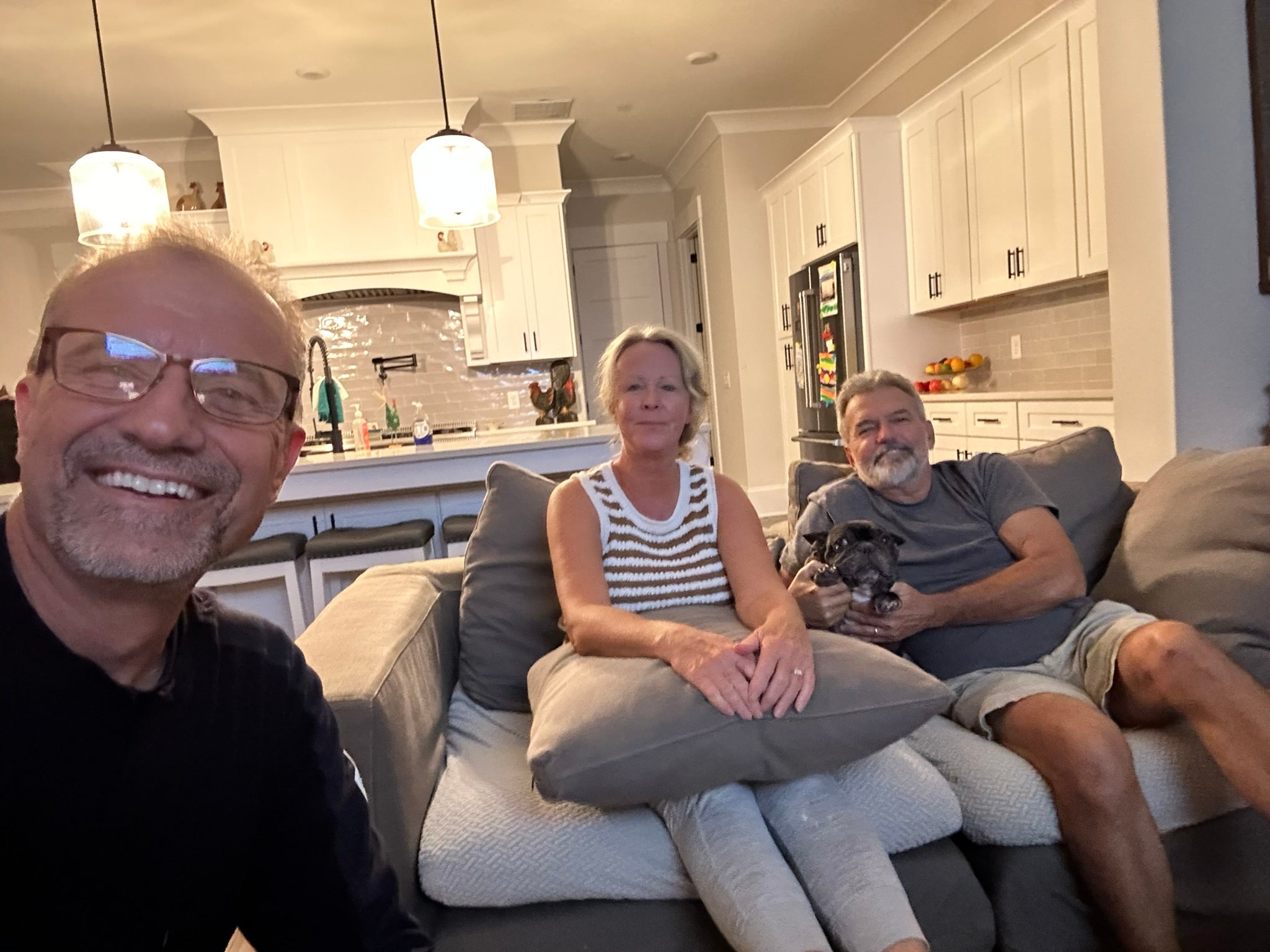 A group of people posing in a living room