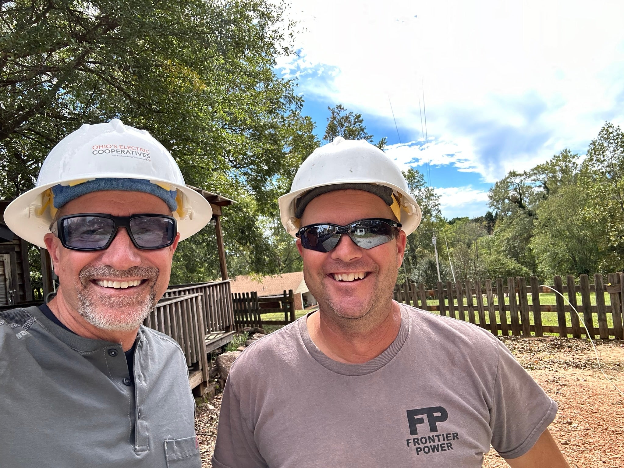 Two men taking a selfie in hard hats