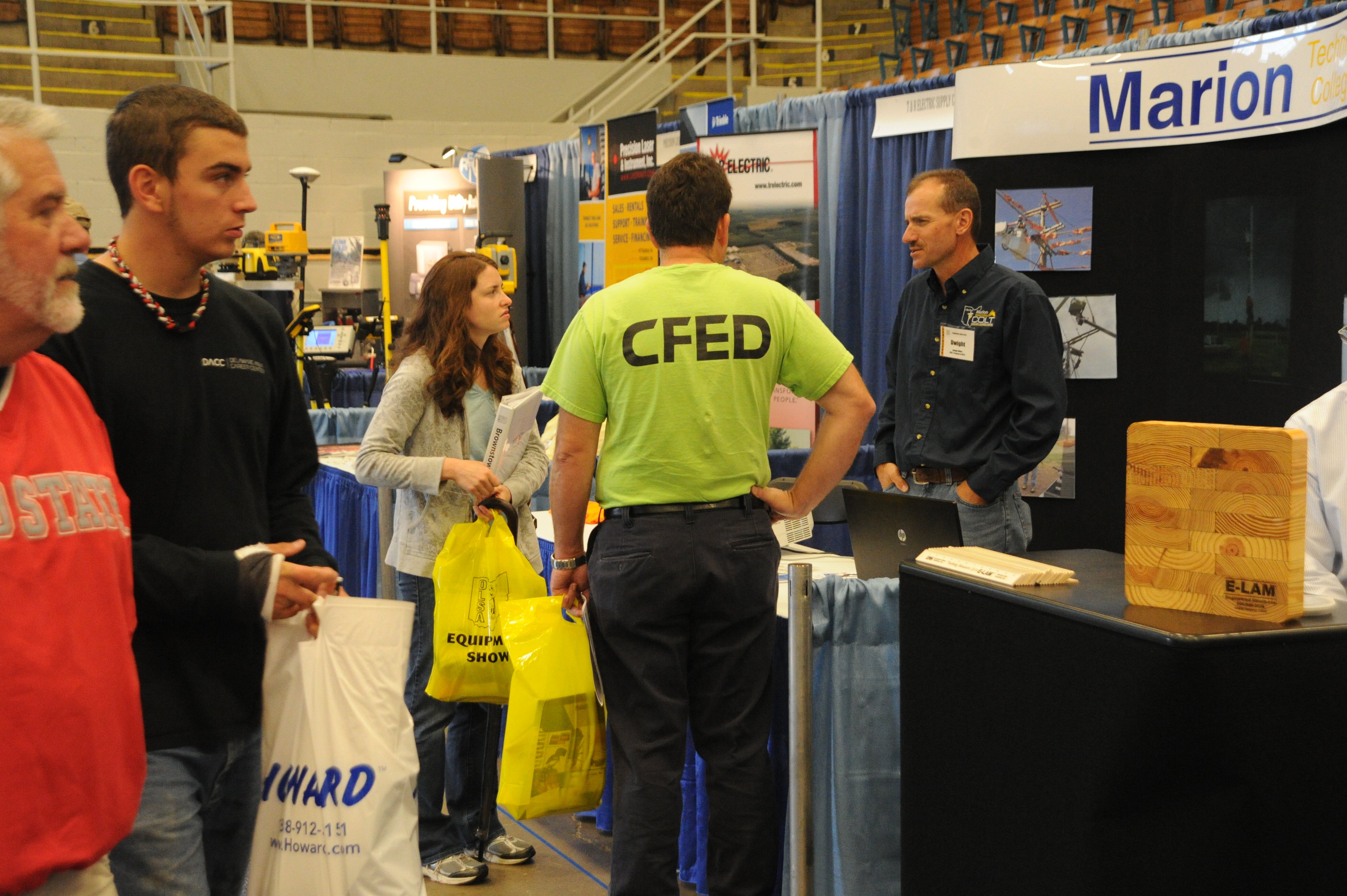 A group of people talking at an expo