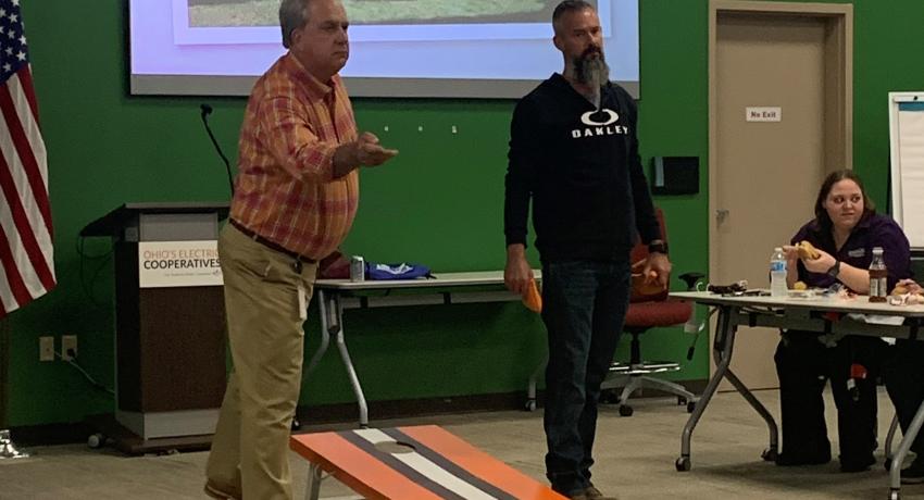 Two members of the OEC team competing in the cornhole tournament. 