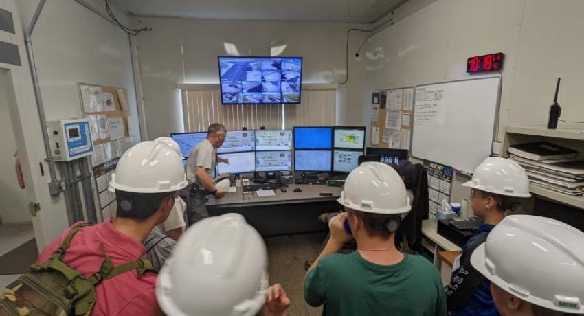 Campers learning about the controls at a power plant