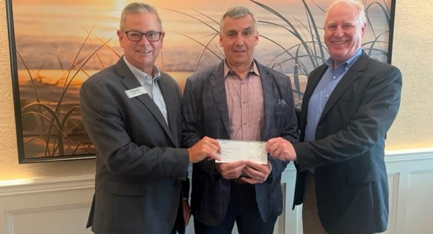 The Community Foundation of Ohio's Electric Cooperatives presented a $2,500 donation to NRECA Board President Tony Anderson. Pictured Left to Right: Doug Miller, Vice President, Ohio's Electric Cooperatives Statewide Services; Tony Anderson, NRECA Board President; Pat O'Loughlin, President and CEO, Ohio's Electric Cooperatives